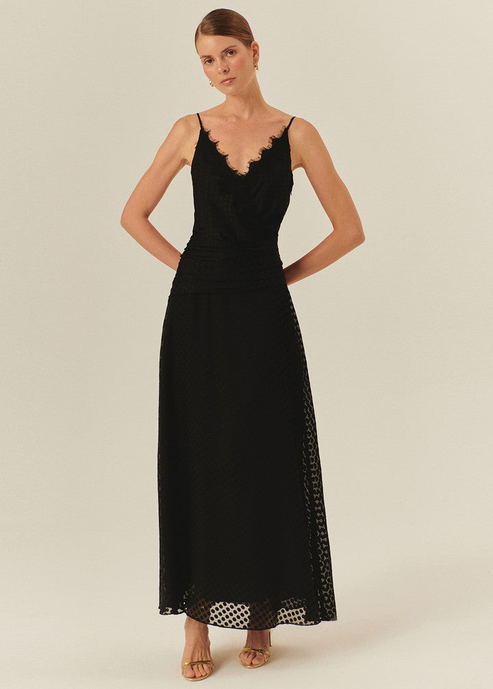Sleeveless Black Maxi Dress with Polka Dot Accents and a Cinched Waist